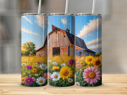 Barn and wildflower field under a blue sky.