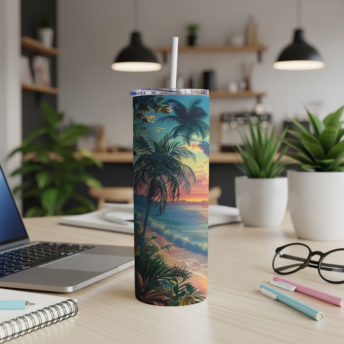 Tropical sunset beach scene on a stainless steel tumbler with straw.
