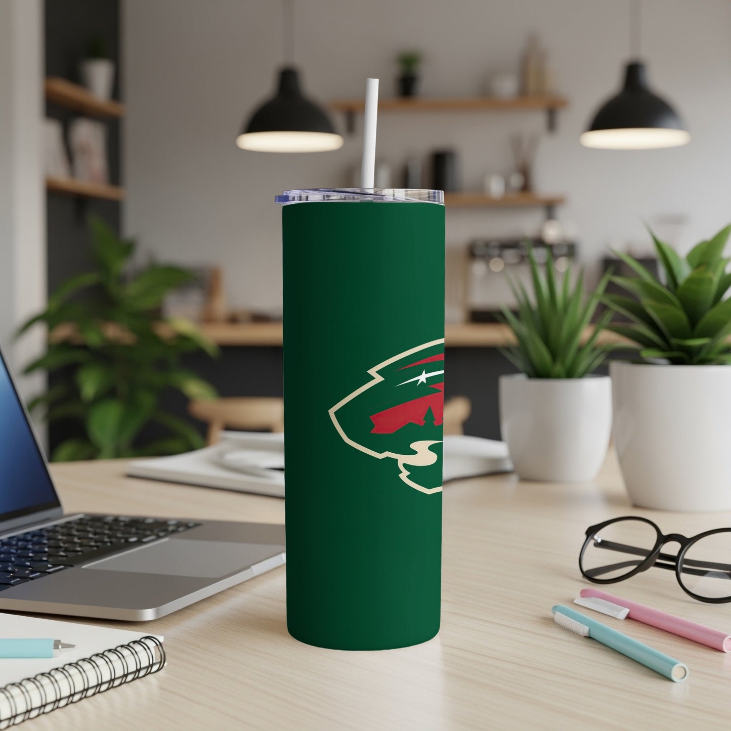 Green tumbler with Minnesota Wild logo and white straw.