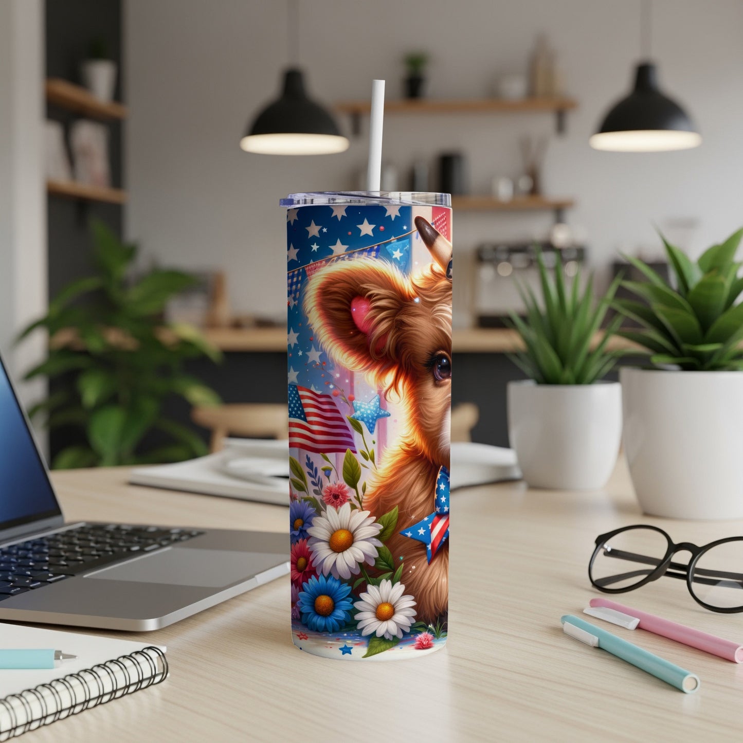 Cow with American flag bandana and flowers on patriotic tumbler.
