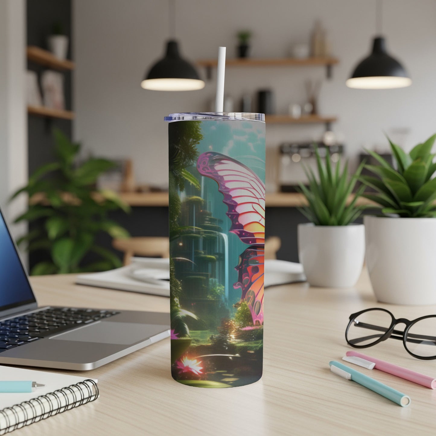 Butterfly and waterfall design on a tall, insulated tumbler.