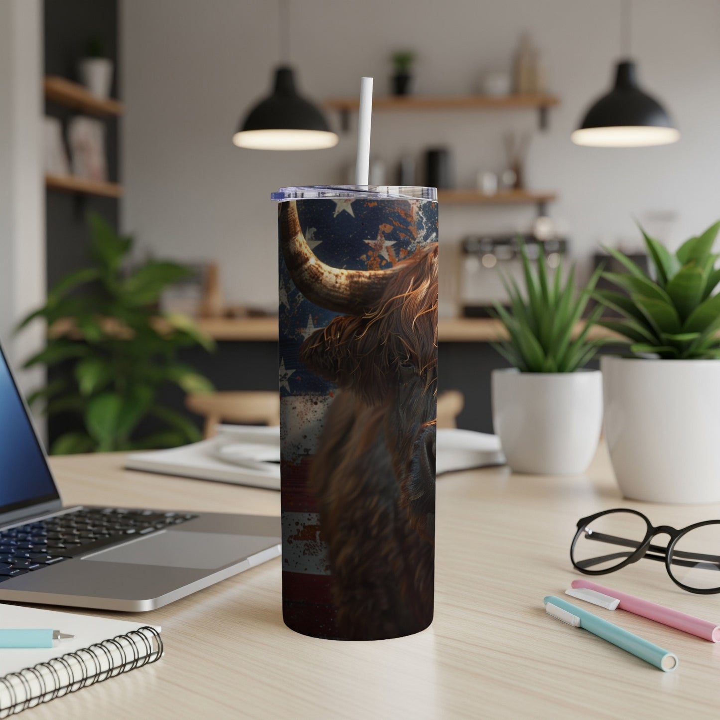 Highland cow portrait on patriotic American flag tumbler with straw.