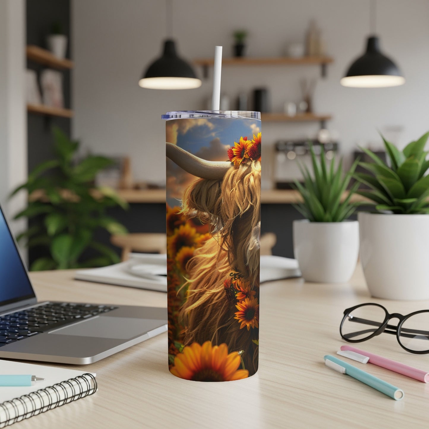 Highland cow with sunflowers on a tumbler cup.