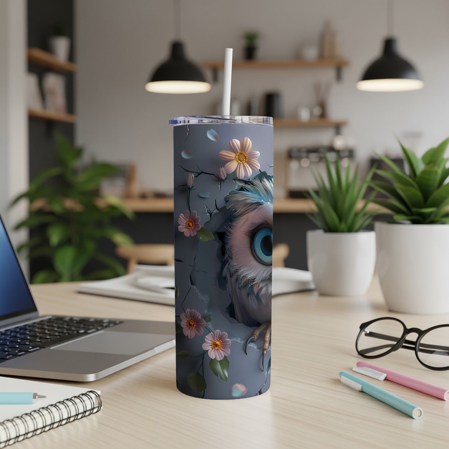 Owl illustration on a grey skinny tumbler with straw, surrounded by flowers.