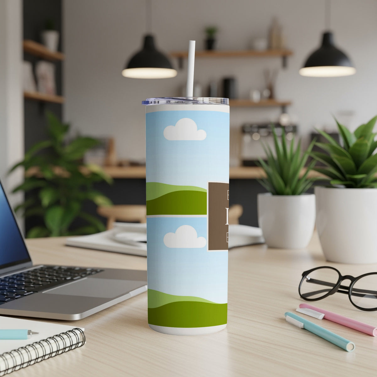 Tumbler with clouds and rolling hills graphic and "I love my" text.
