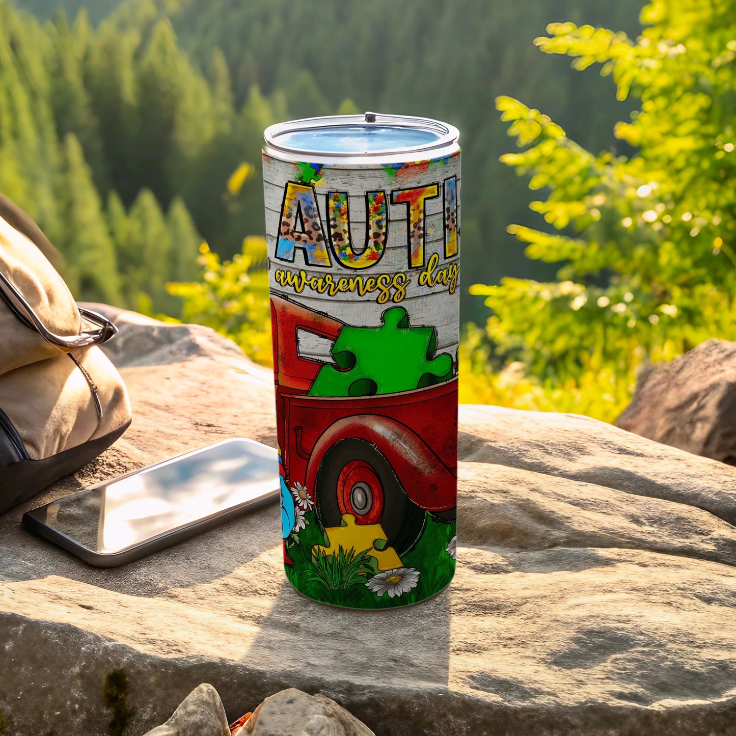 Red truck with "Autism Awareness Day" text on a tumbler.