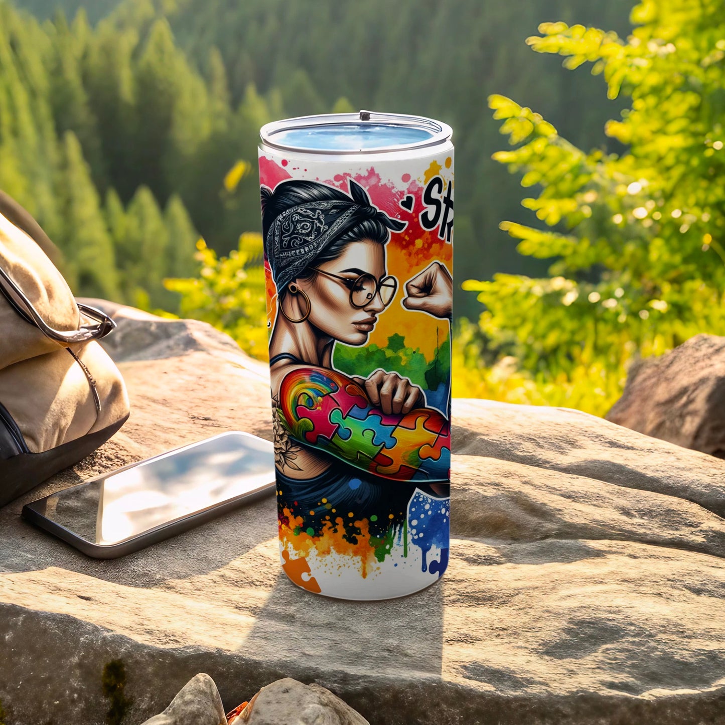 Tumbler with woman flexing arm, puzzle pieces, and "She is" text.