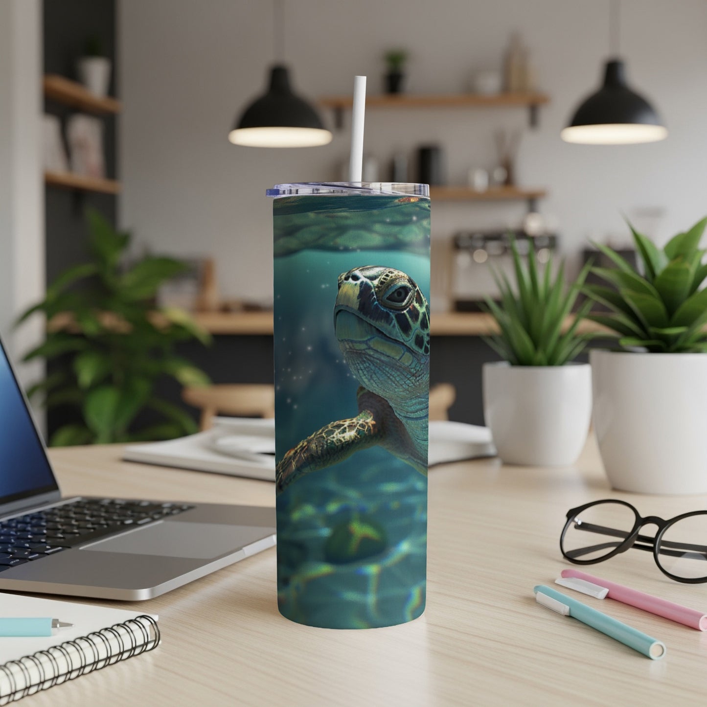 Sea turtle swimming underwater on a white tumbler.