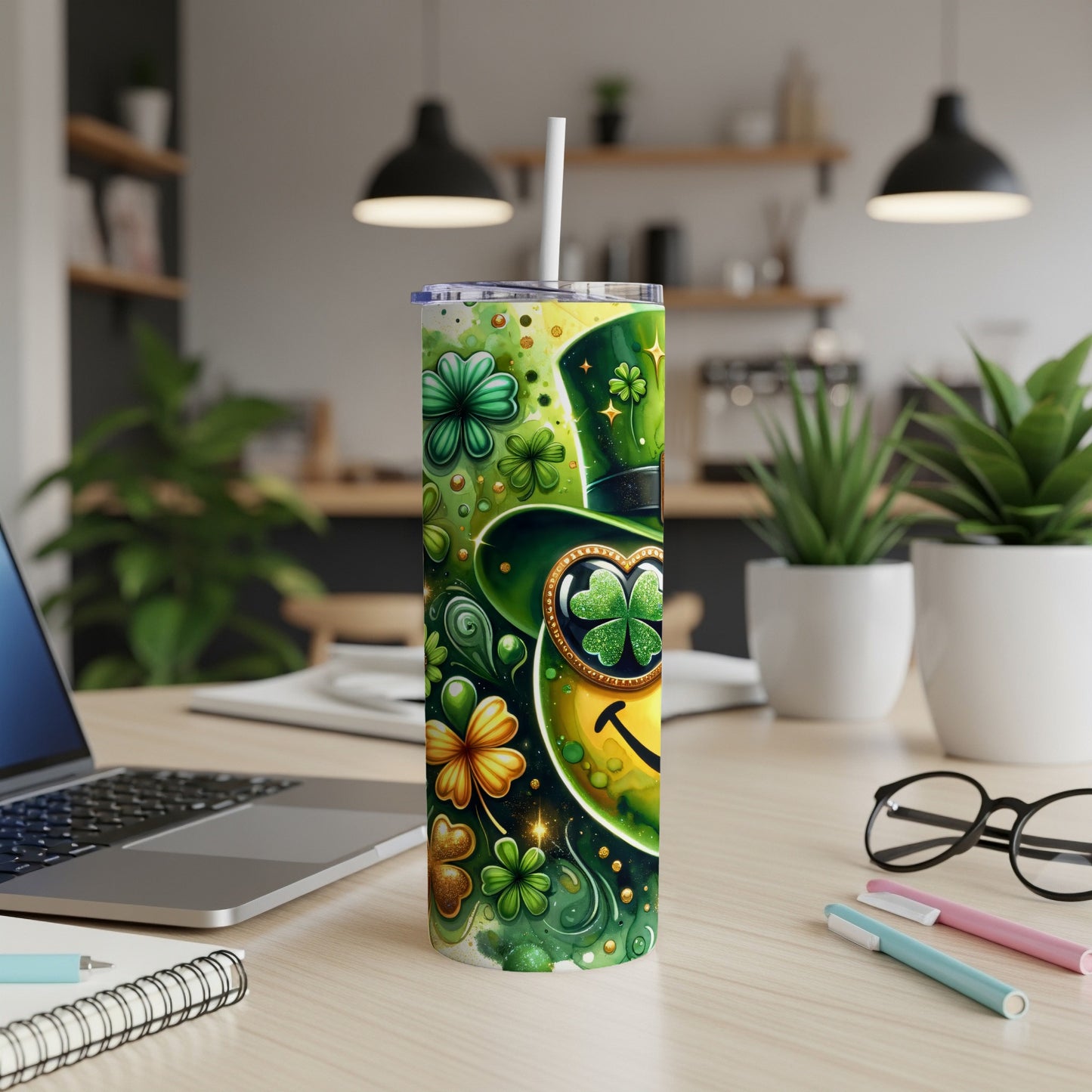 Green tumbler with shamrocks, a leprechaun hat, and a smiley face.