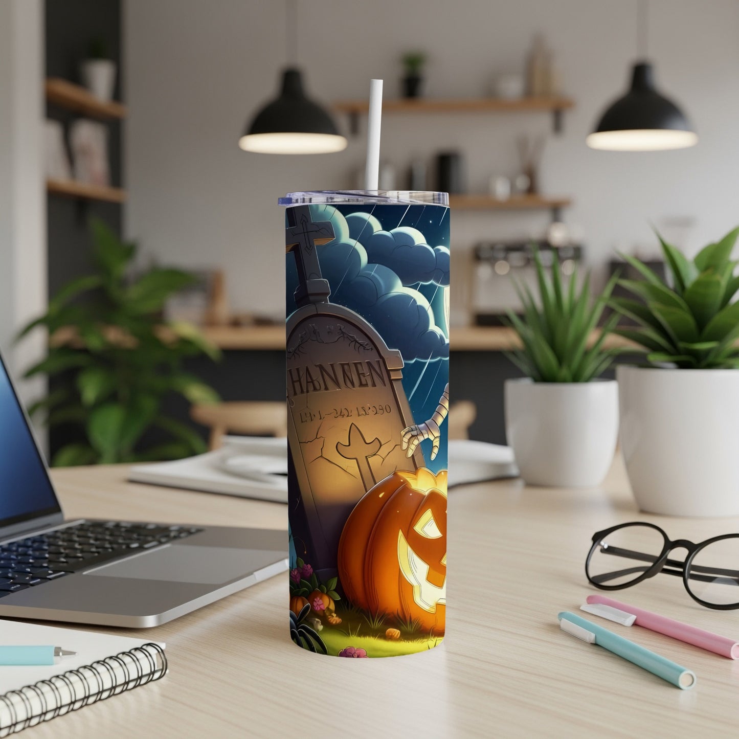 Halloween tumbler with tombstone, pumpkin, and spider graphic.