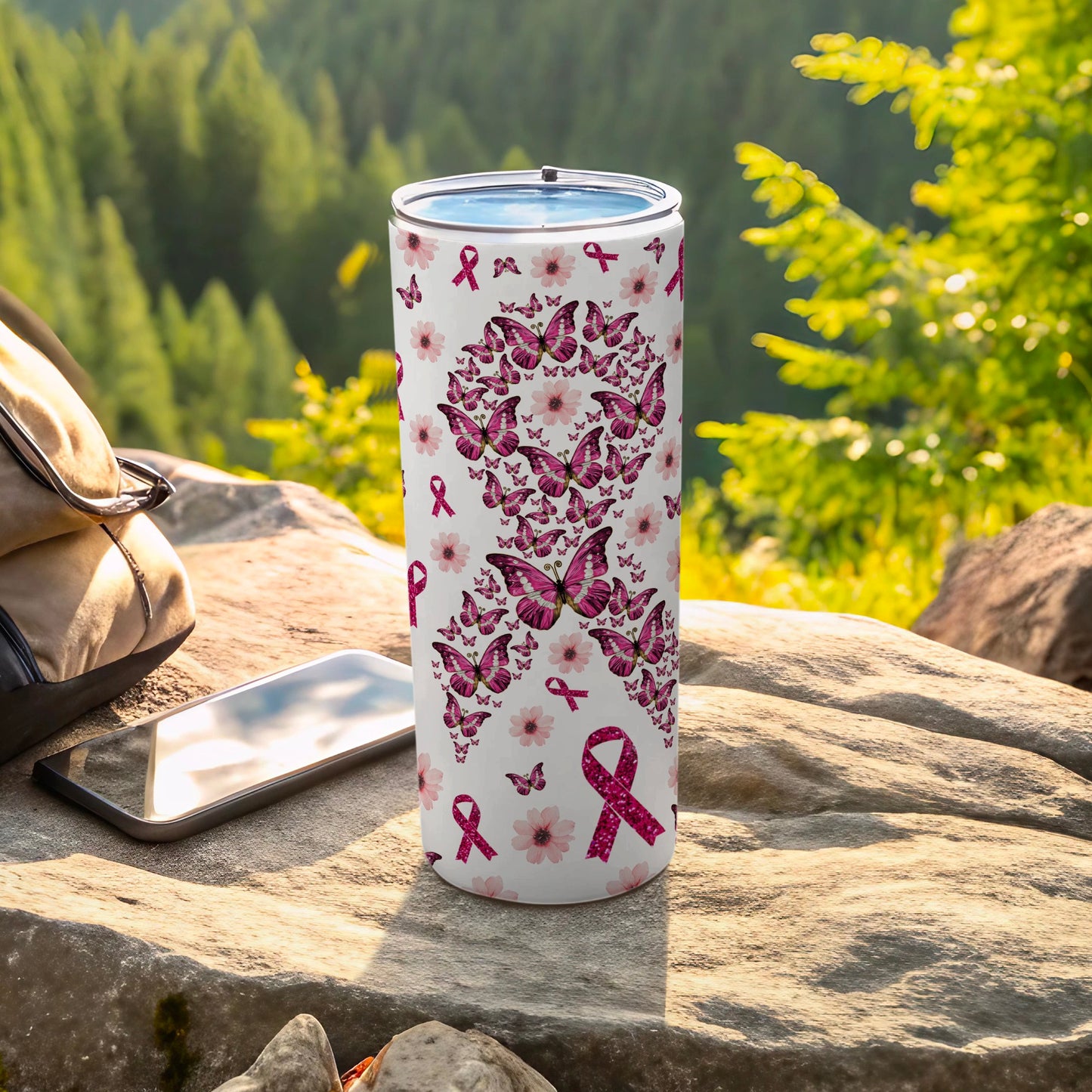 Tumbler with pink butterflies, flowers, and breast cancer awareness ribbons.