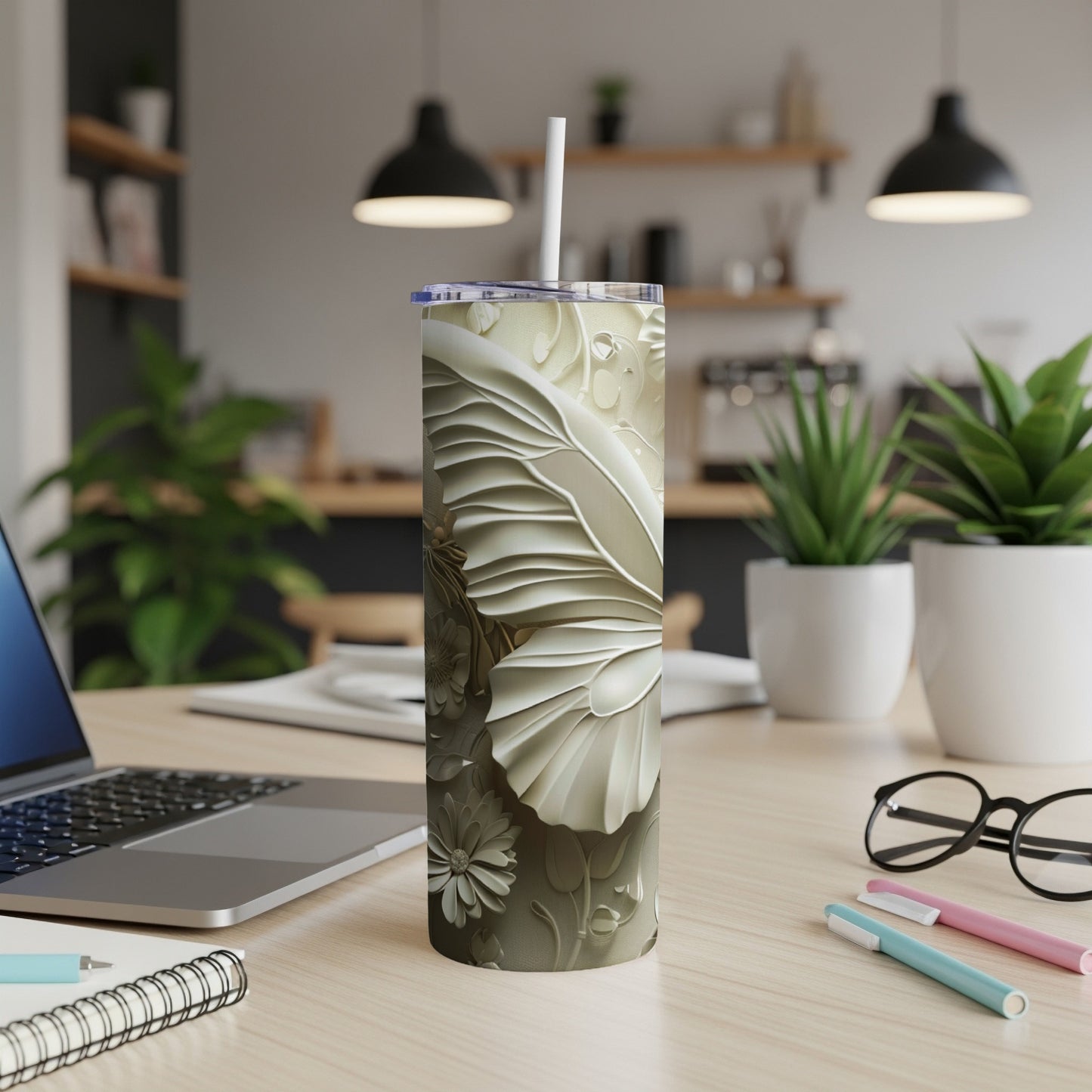Creamy textured tumbler with floral and butterfly embossed design.