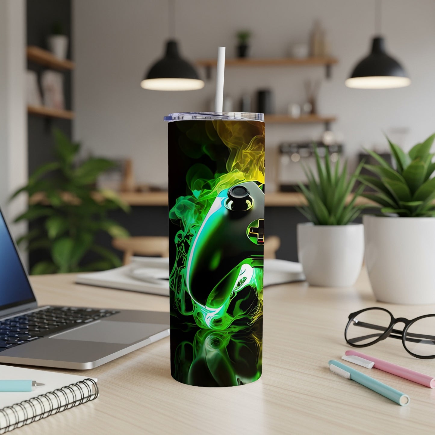 Gaming controller with green and yellow smoke design on a tumbler.