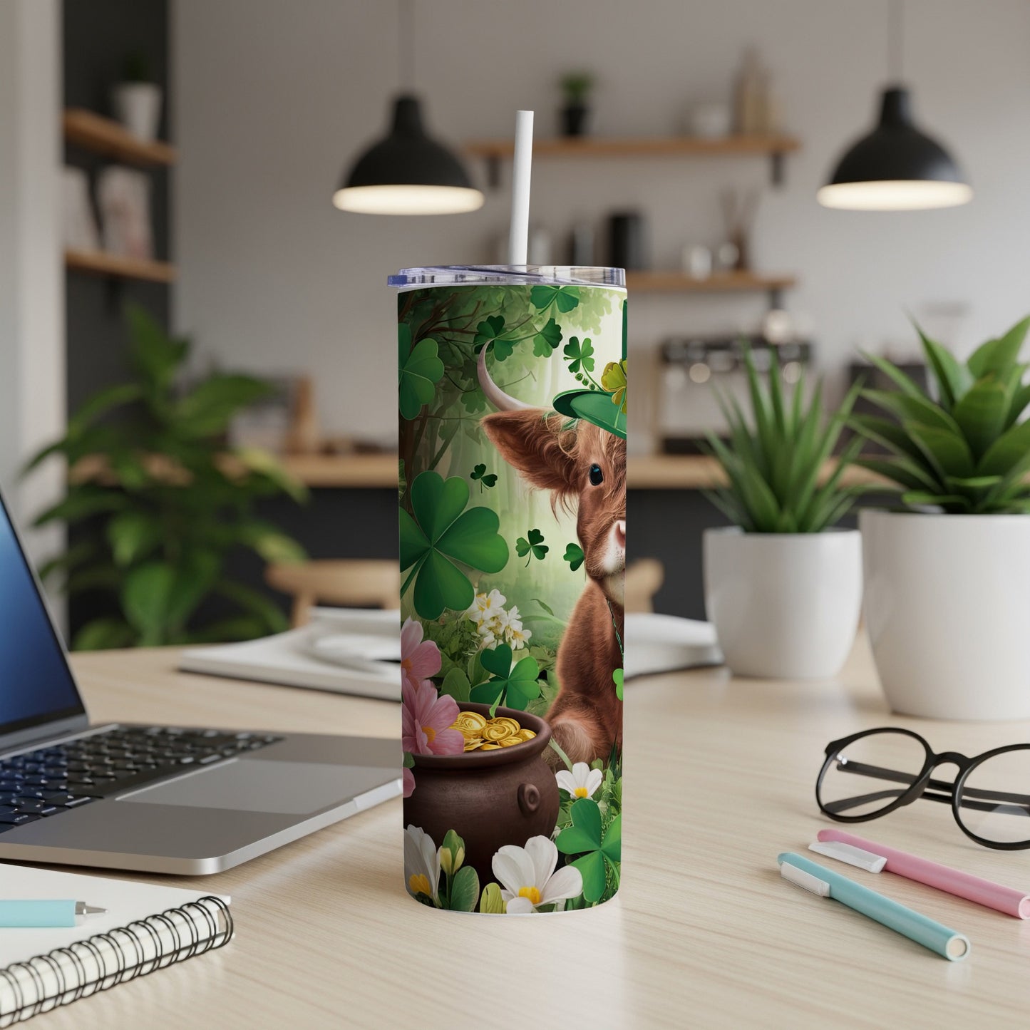 Highland cow in hat with clovers and pot of gold on St. Patrick's Day tumbler.