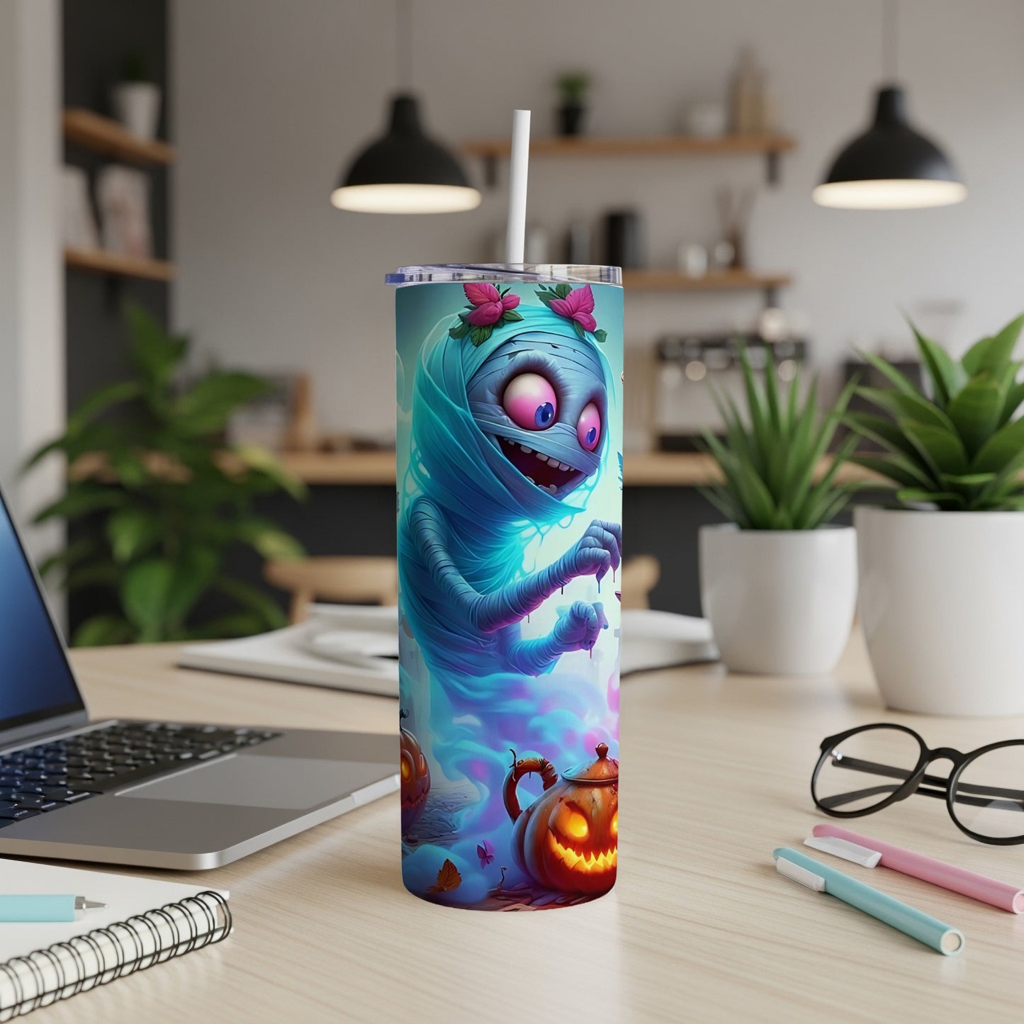 Tumbler with a cartoon mummy and spooky pumpkins design.