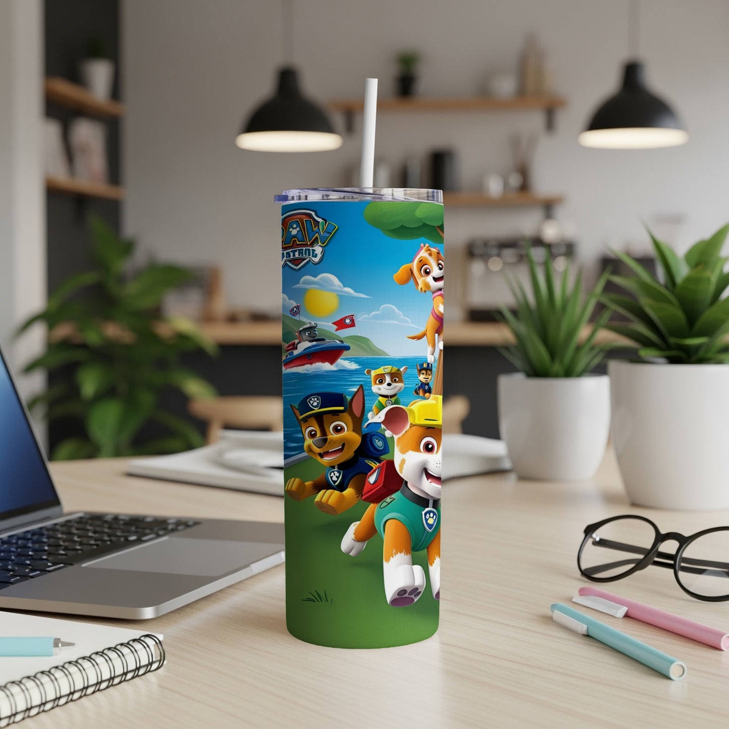 Paw Patrol characters on a green background, with a laptop and office supplies.