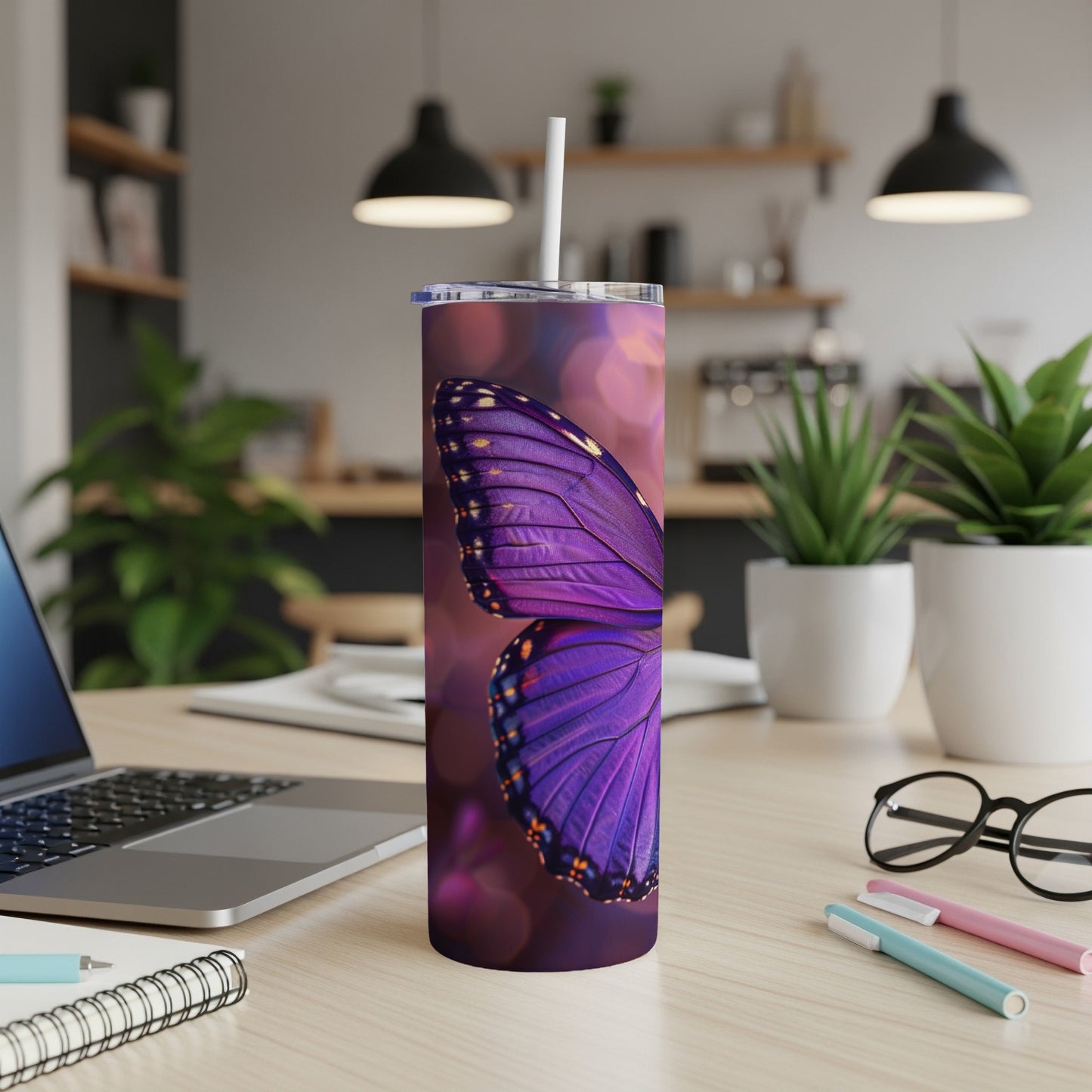 Purple butterfly wing pattern on a tumbler with a straw.
