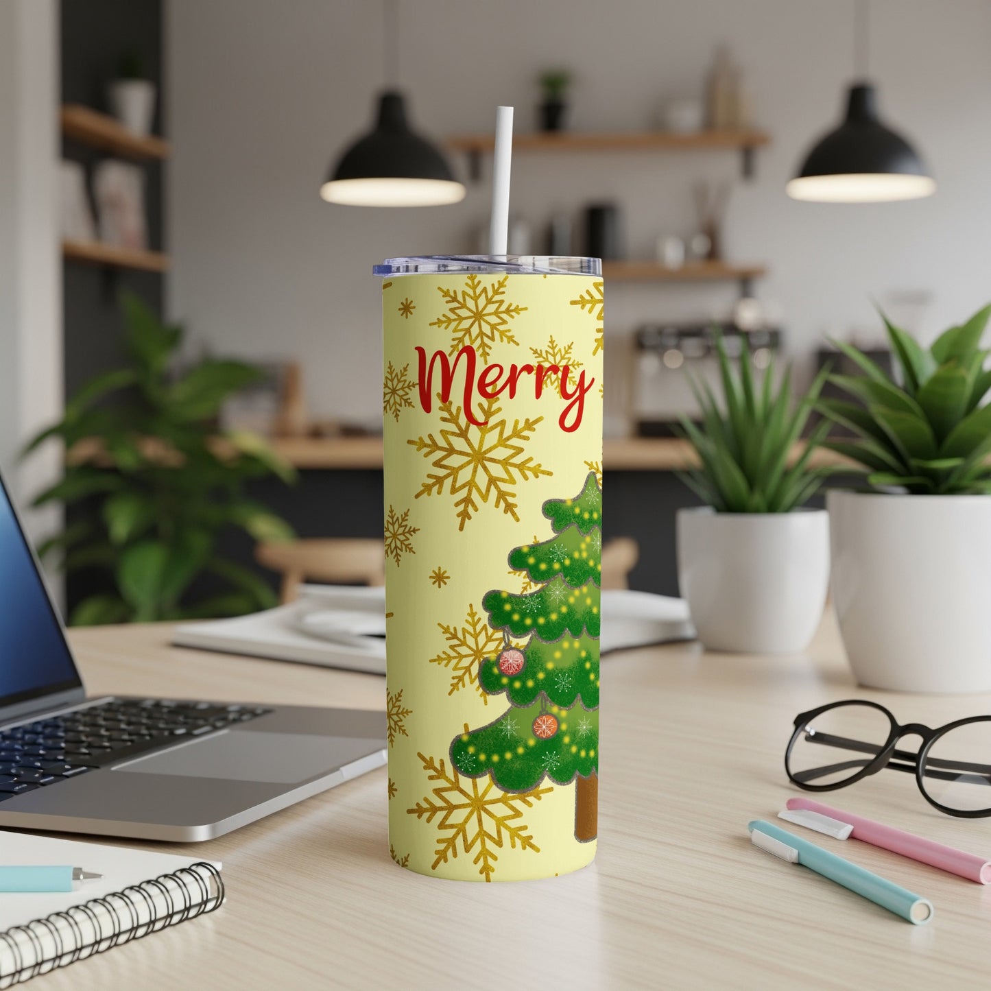 Yellow tumbler with Christmas tree, ornaments, snowflakes, and "Merry" text.