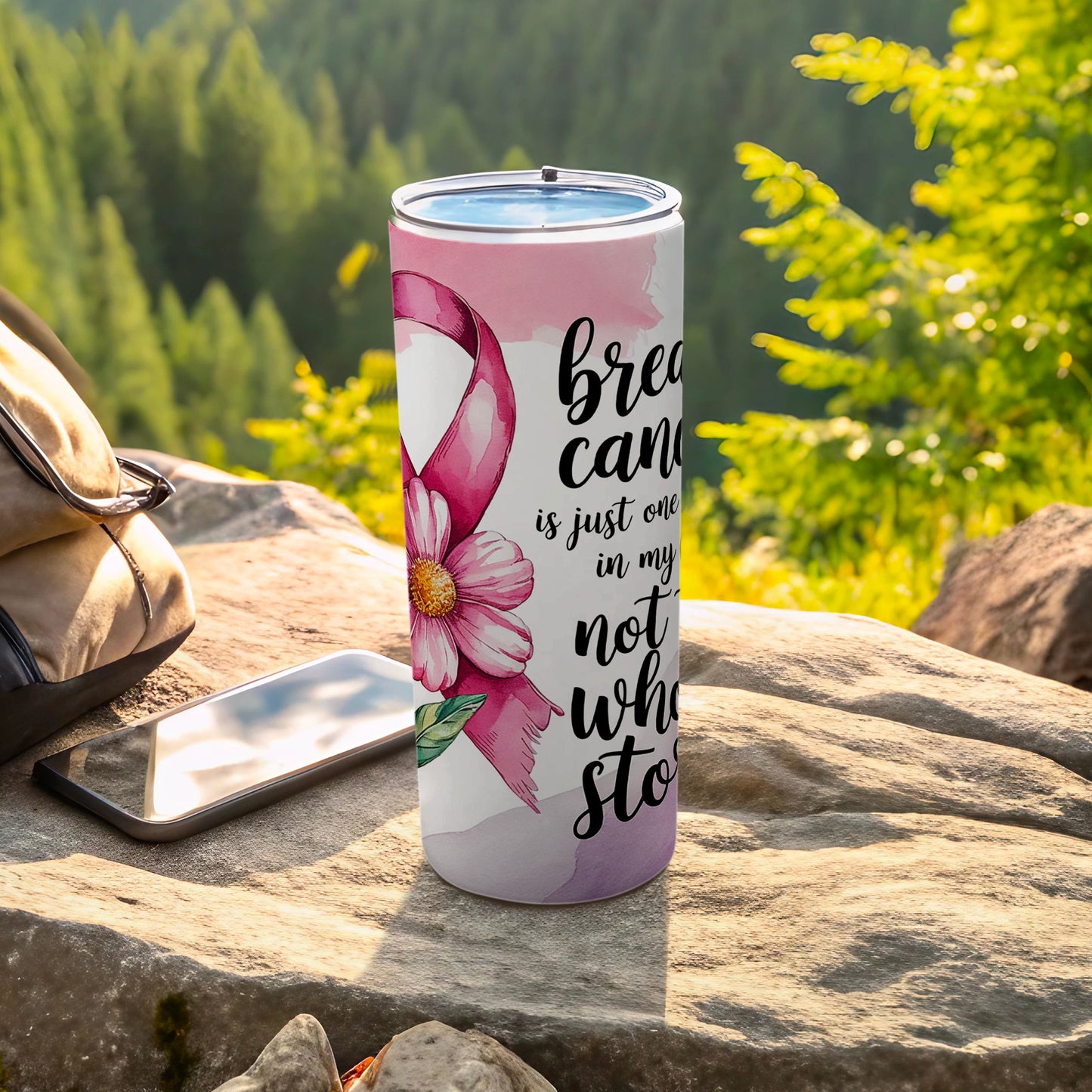 Pink ribbon and flower design on tumbler with inspirational quote.