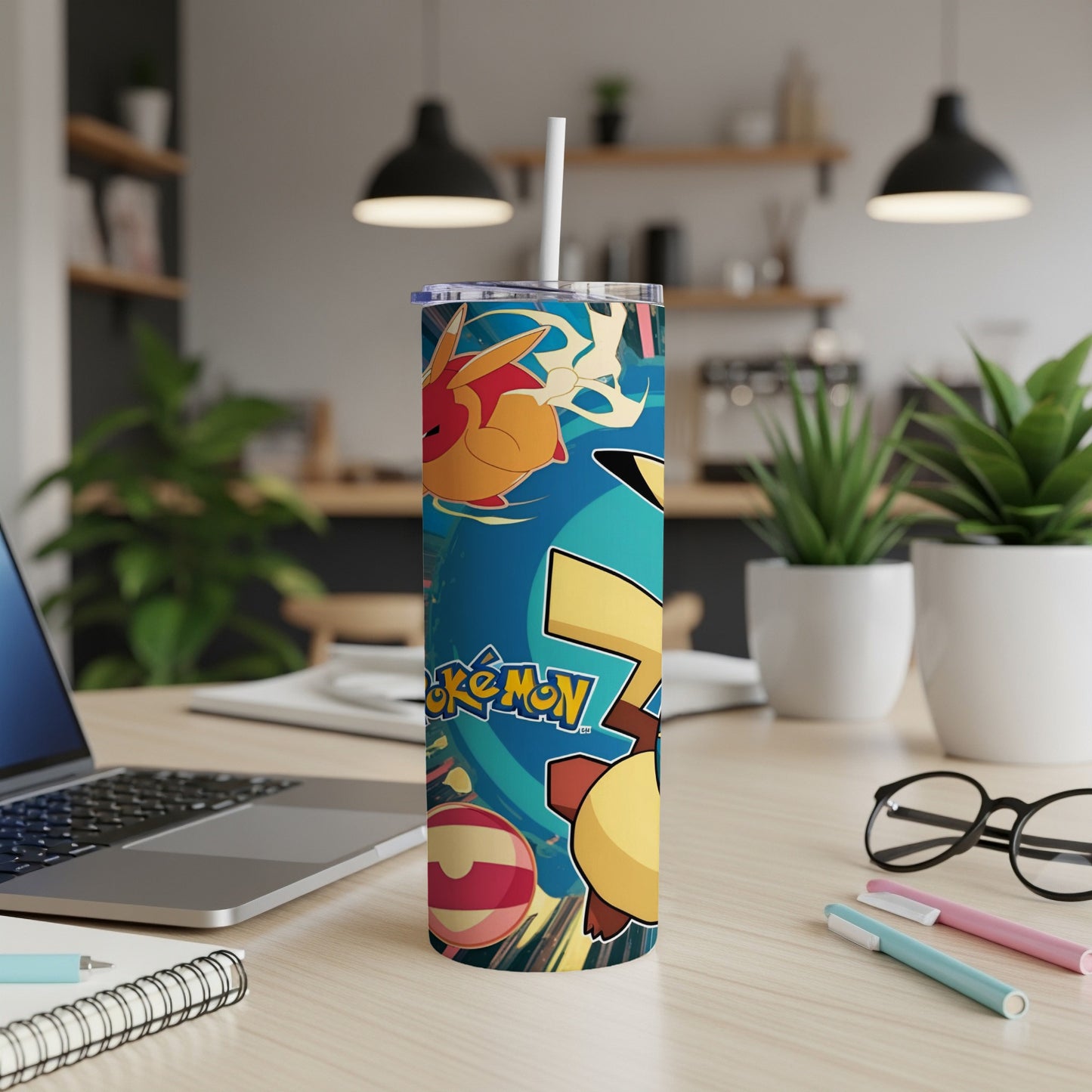 Pokemon characters and designs on a blue tumbler with a white straw.