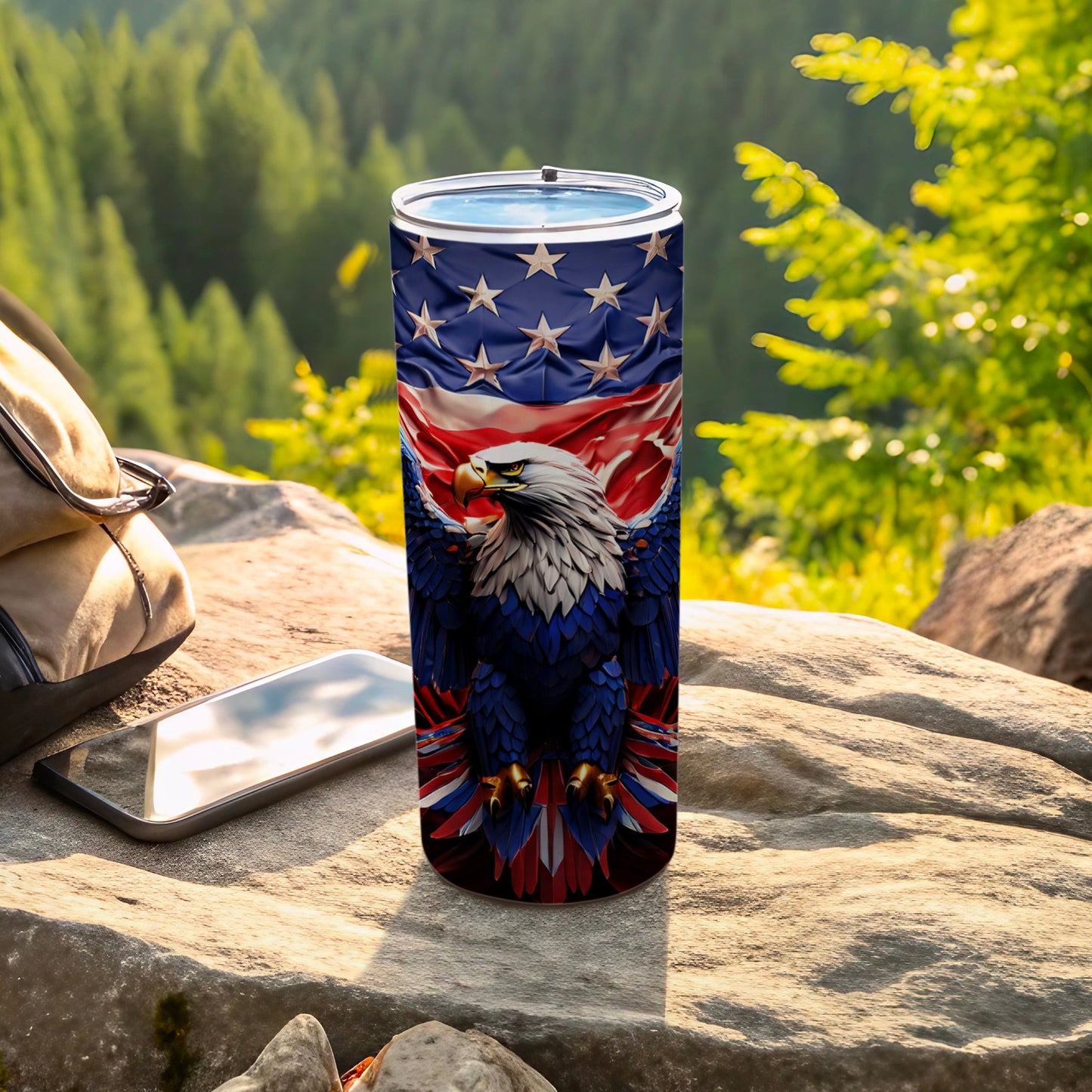 Patriotic eagle on American flag tumbler with phone and backpack outdoors.