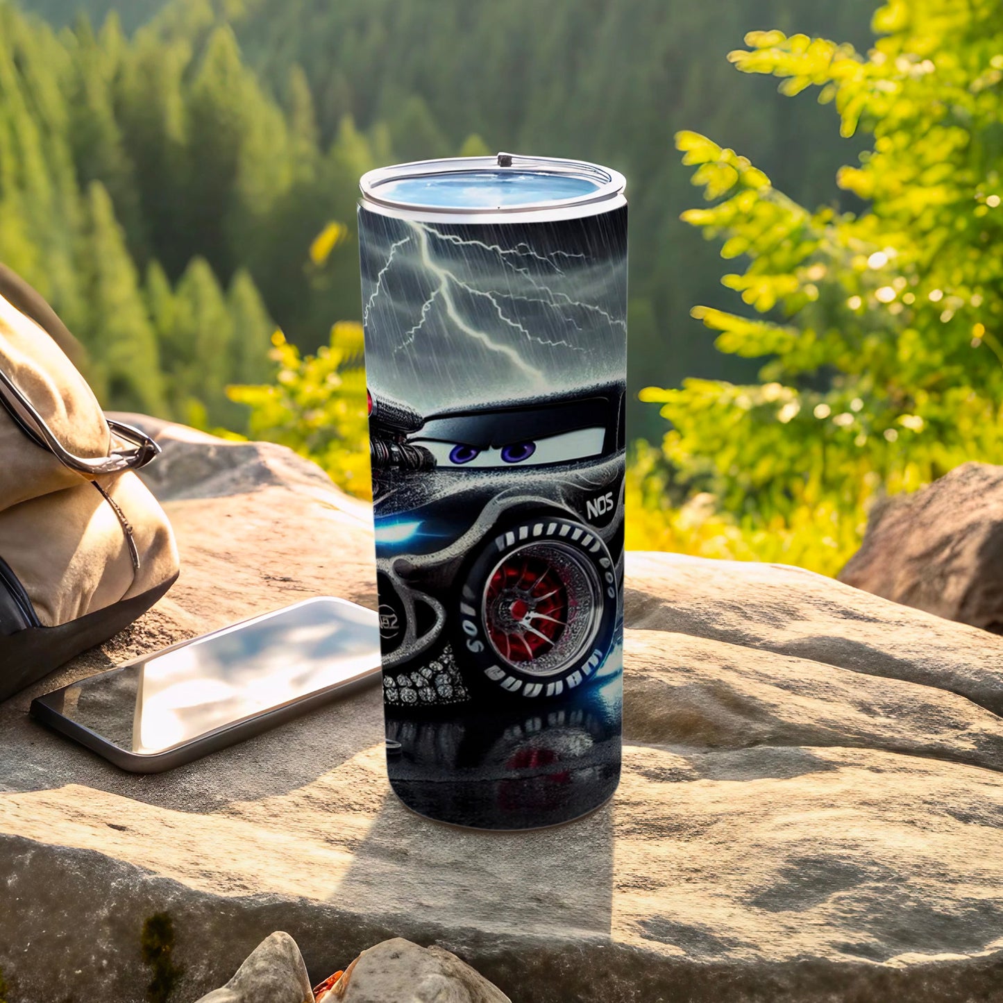 Lightning McQueen tumbler with skull and NOS graphic on rocky terrain.