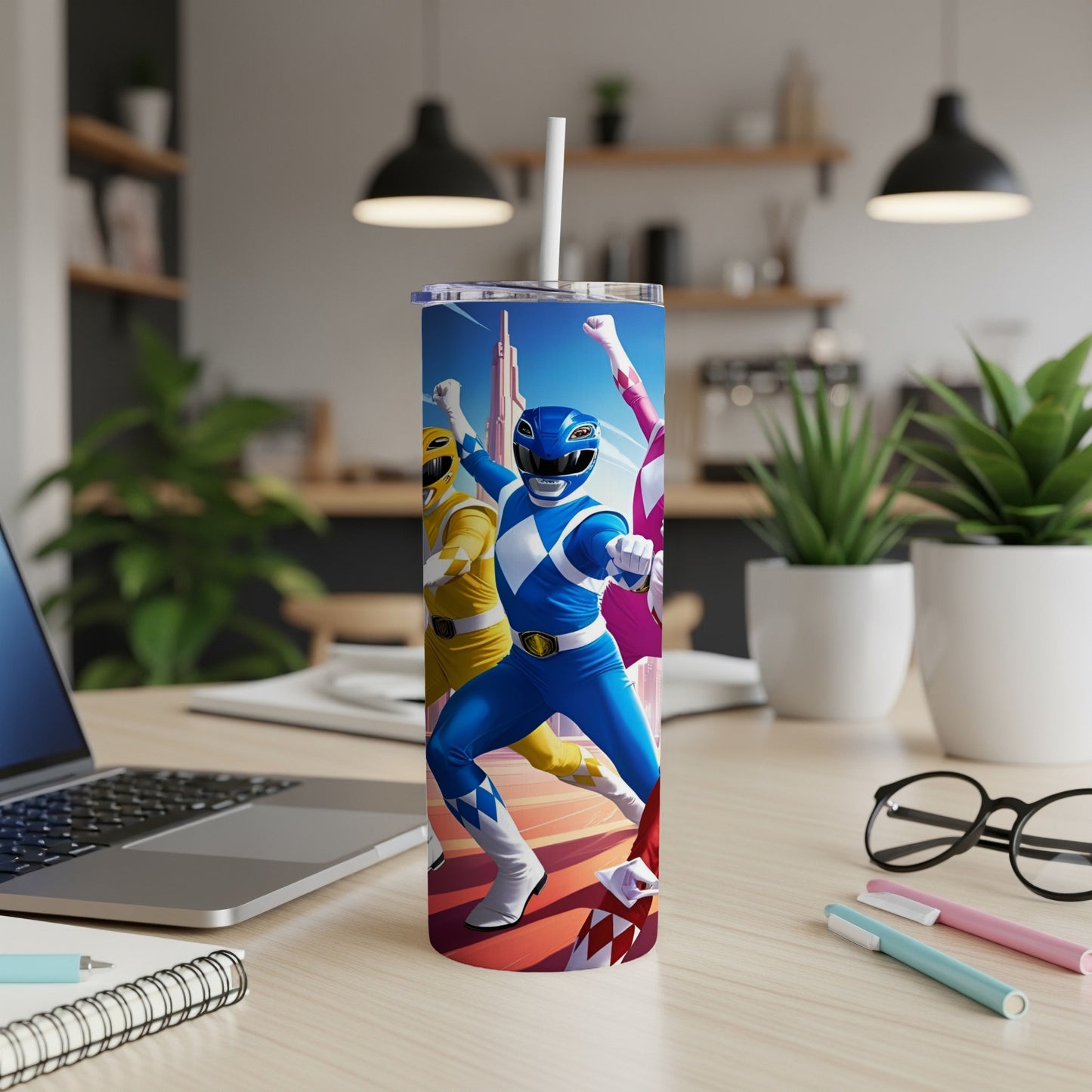 Blue, yellow, and pink Power Rangers on a tumbler.