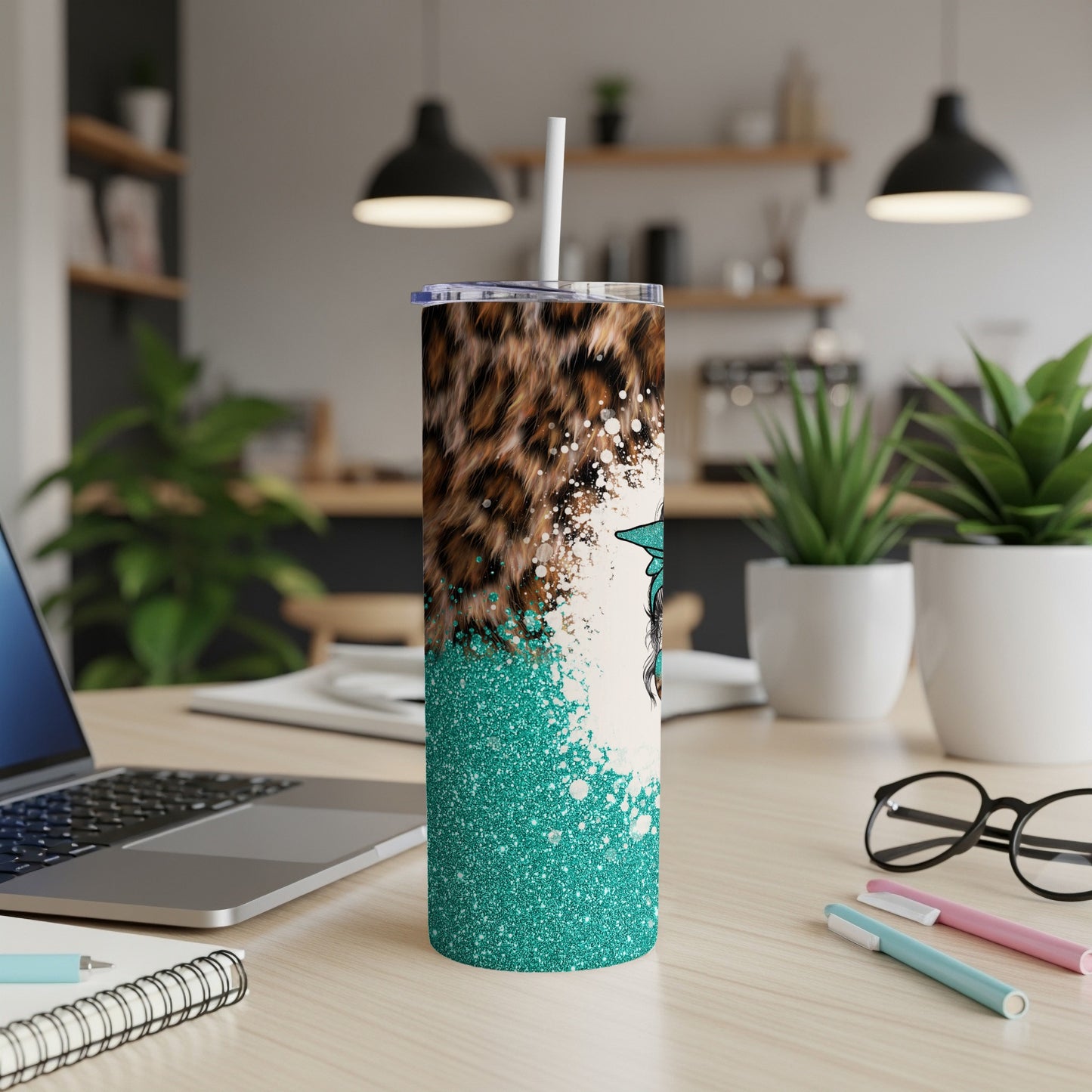 Glitter teal tumbler with leopard print and turquoise graphic.