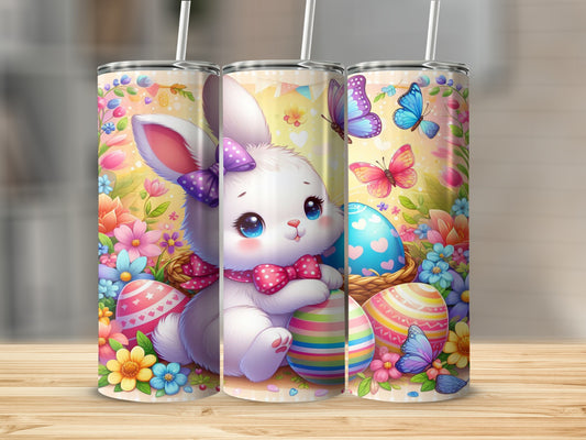 White bunny with bow hugs Easter egg surrounded by flowers and butterflies.
