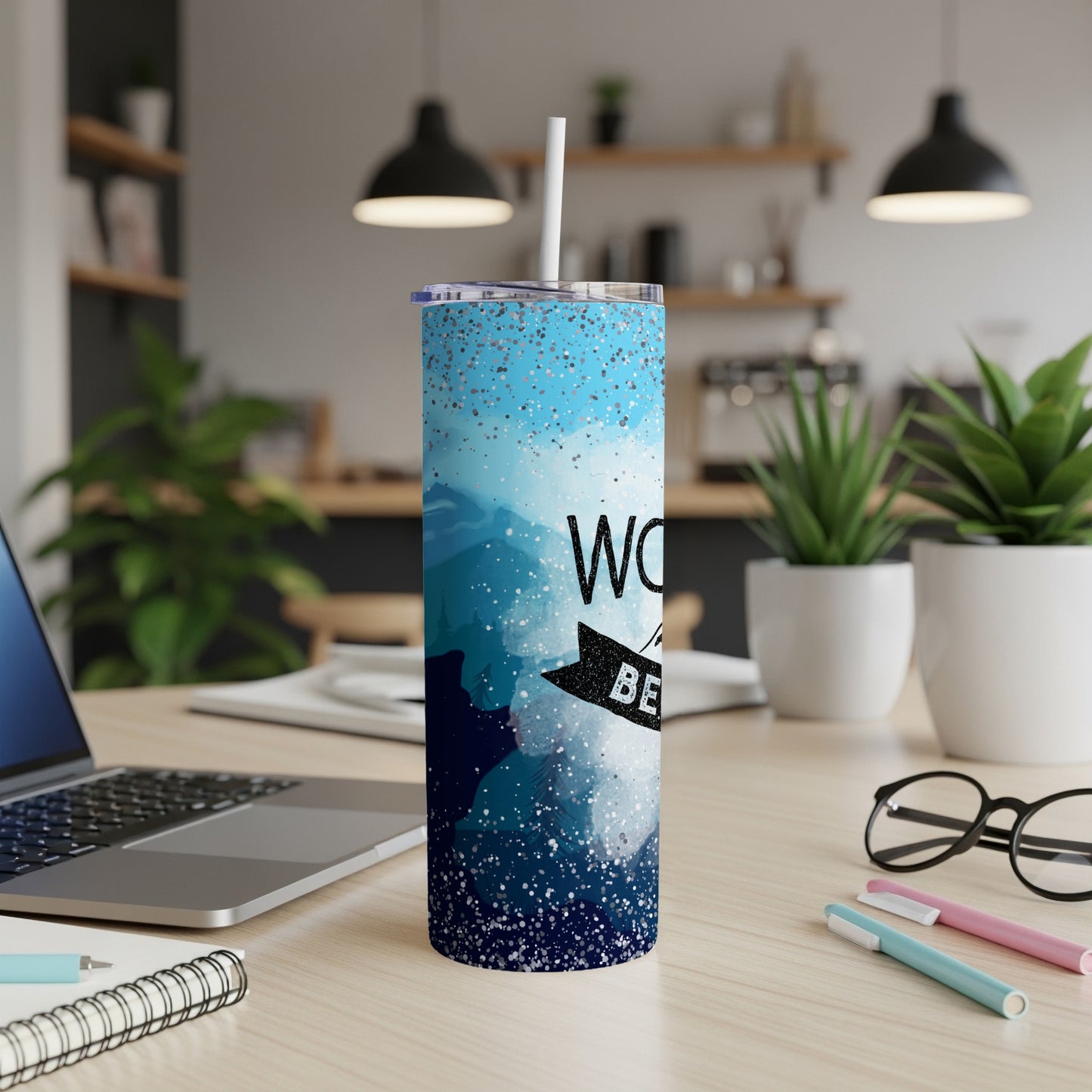 Blue speckled tumbler with text "WORST PERSON BEST LIFE" on desk.
