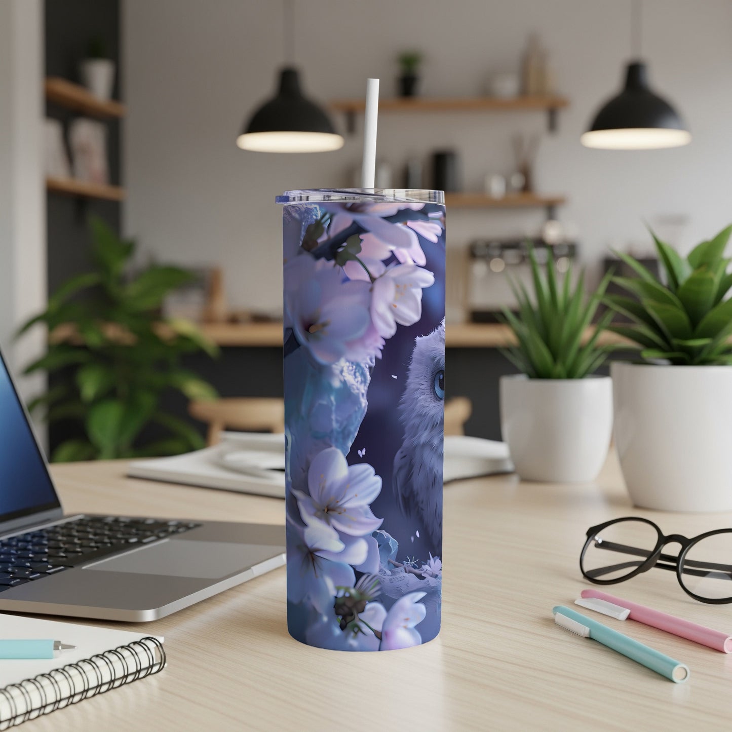 Blue owl and cherry blossoms on a white skinny tumbler.