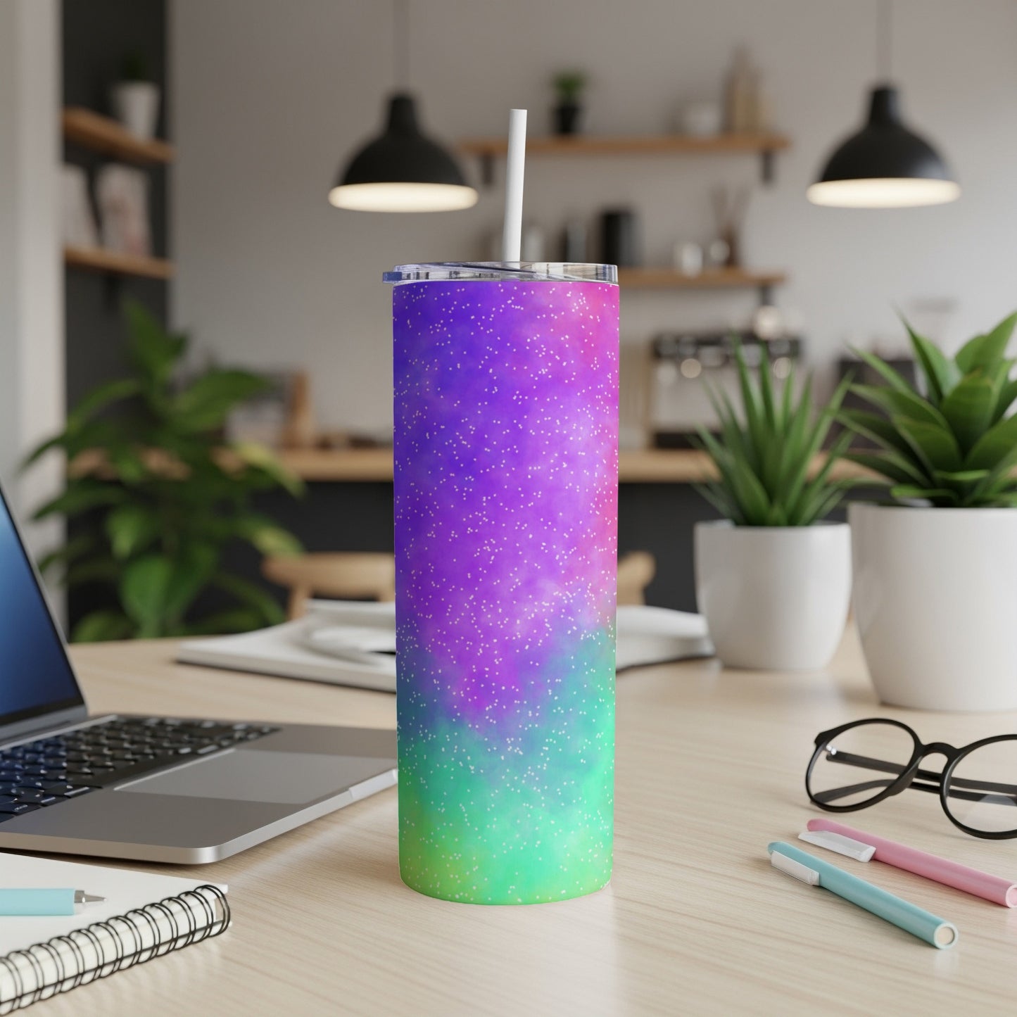 Tumbler with purple, pink, and green gradient galaxy design with white speckles.