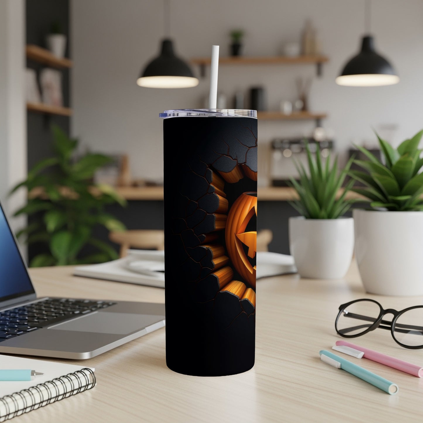 Black tumbler with cracked texture and jack-o'-lantern design.