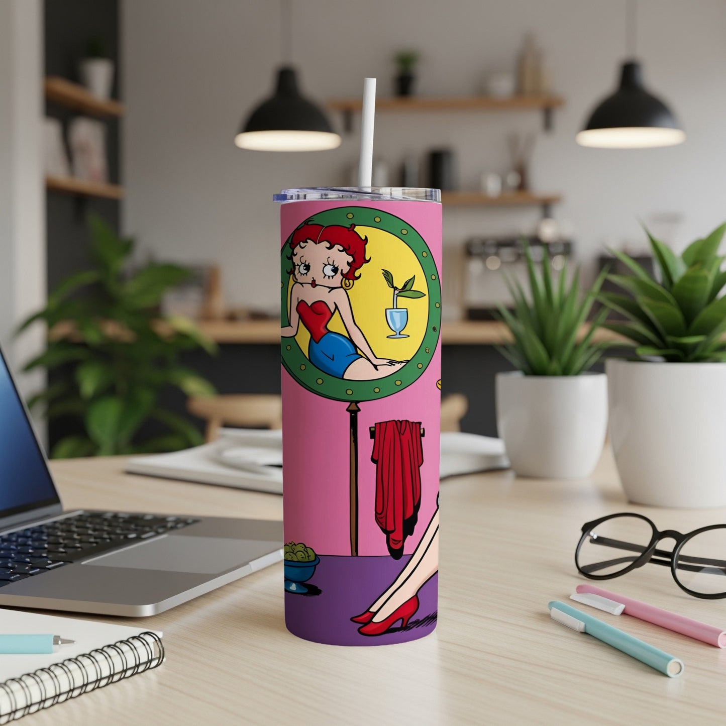 Betty Boop in a pink circle on a pink tumbler with a straw.