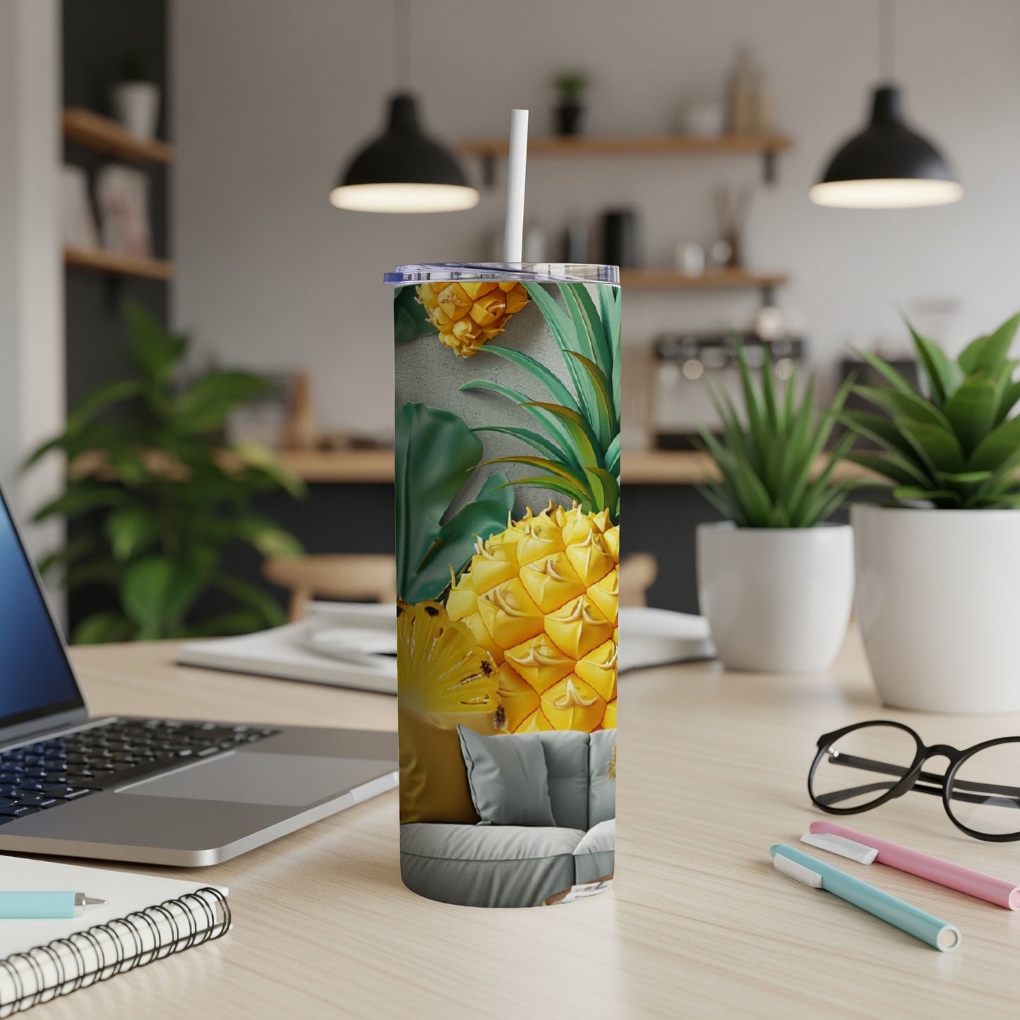 Tumbler with a close-up pineapple design featuring green leaves and textured background.