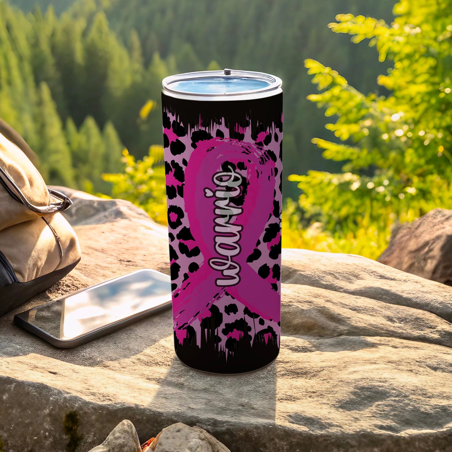 Black tumbler with pink leopard print and "Warrior" text on a ribbon.