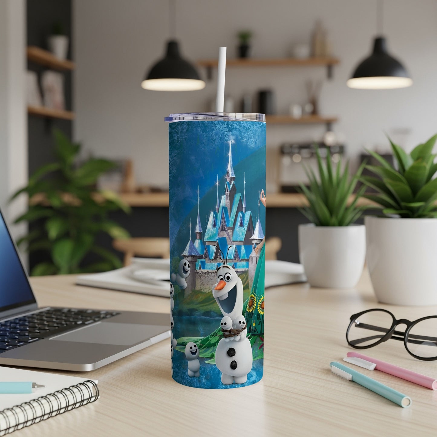 Blue tumbler with Elsa's ice castle and Olaf from Frozen.