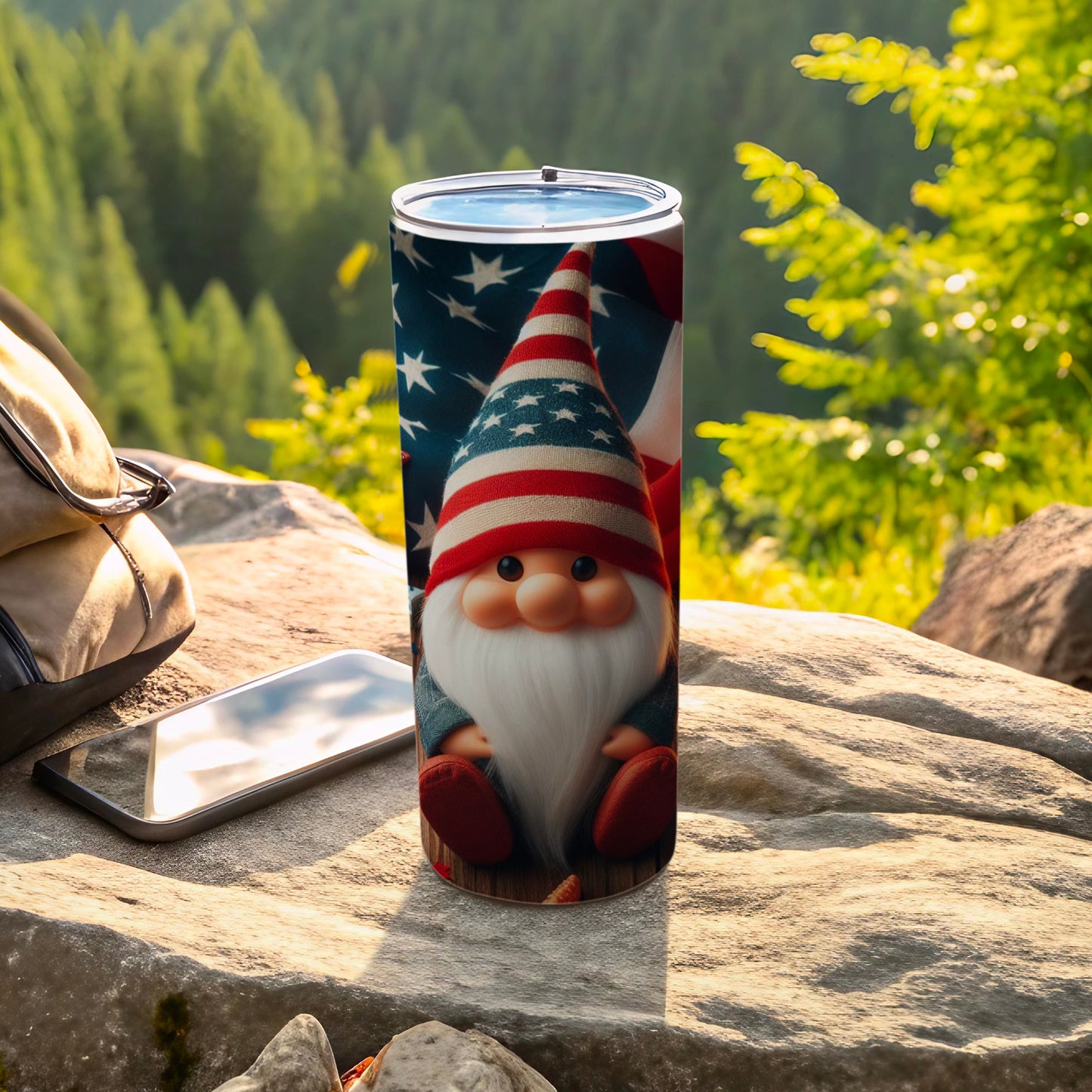 Gnome wearing American flag hat sitting on rocks with backpack and phone.