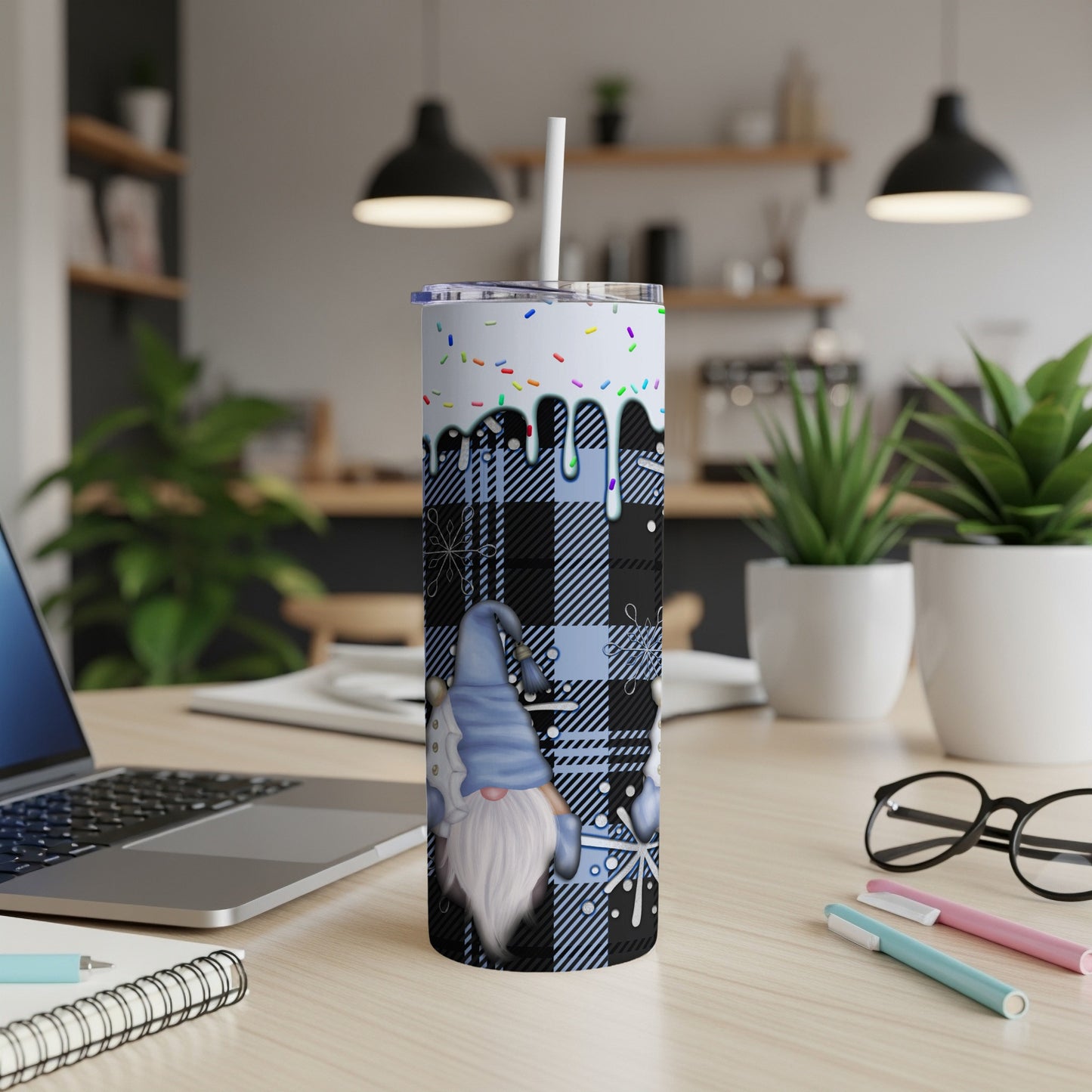 Blue buffalo plaid gnome tumbler with white snowflakes and colorful sprinkles.