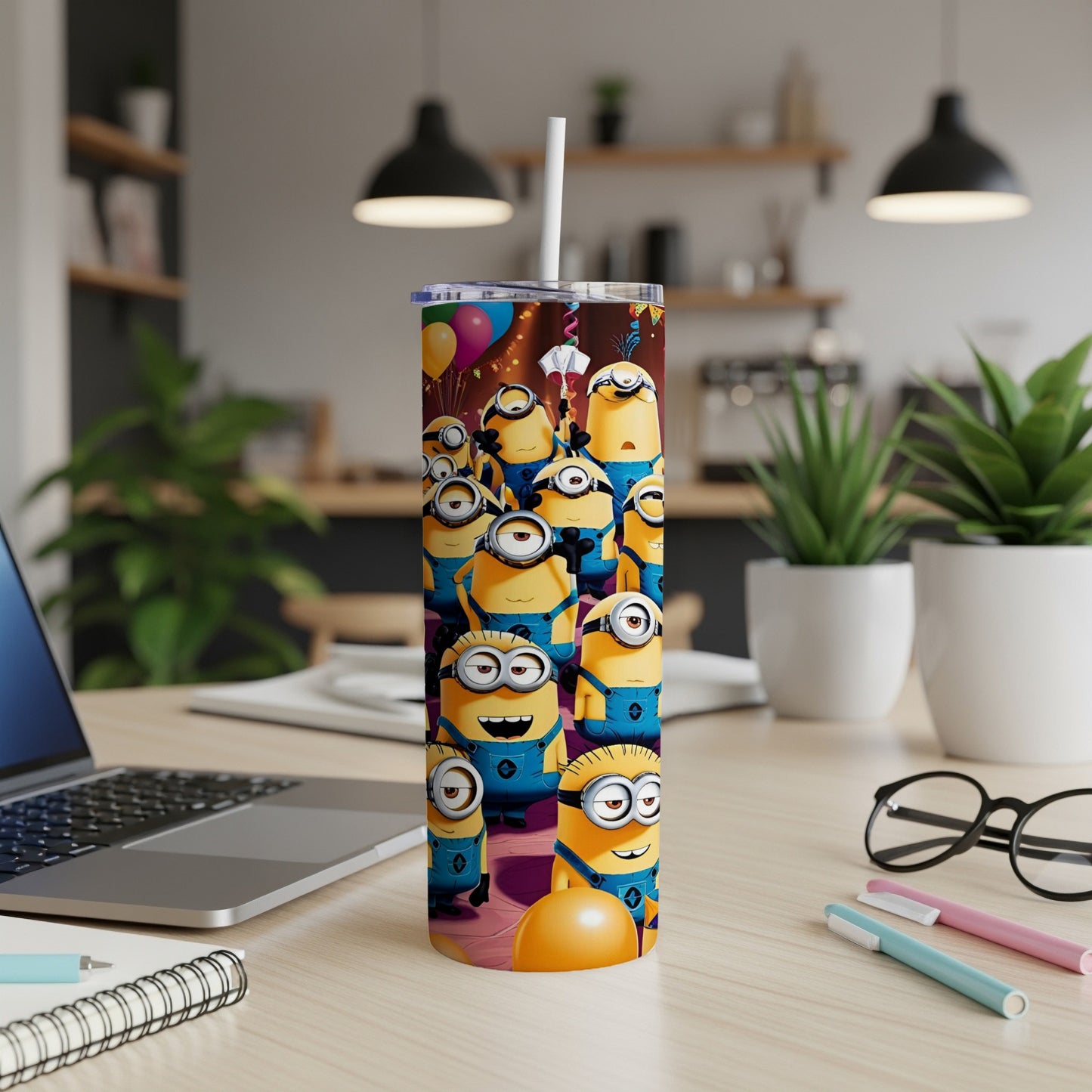 Minions characters celebrating with balloons and confetti on a tumbler.