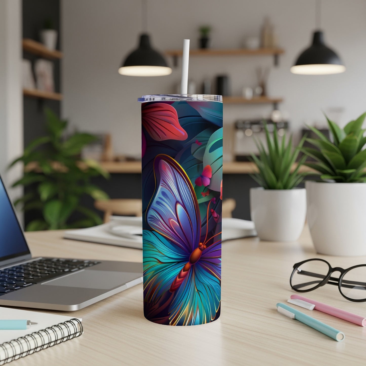 Blue and teal butterfly on a dark floral background, on a white tumbler.