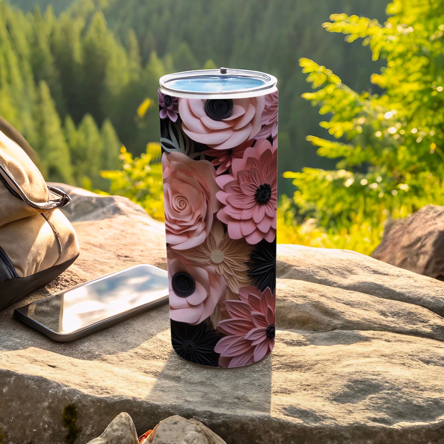 Floral pattern tumbler with mountains in background.