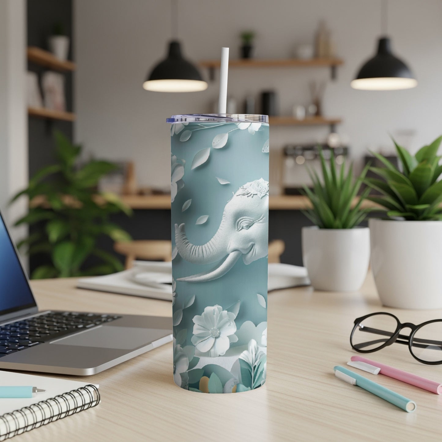 Light blue floral tumbler with an elephant head design.