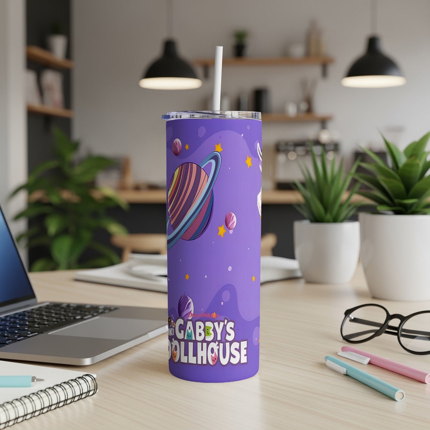 Purple Gabby's Dollhouse tumbler with planets and stars, straw included.