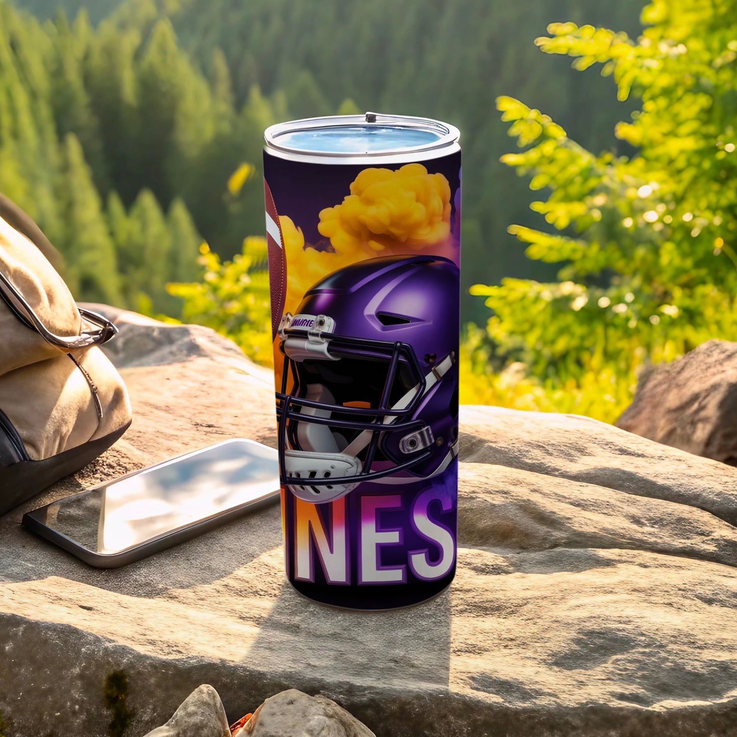 Purple football helmet and "NES" text on a tumbler outdoors.