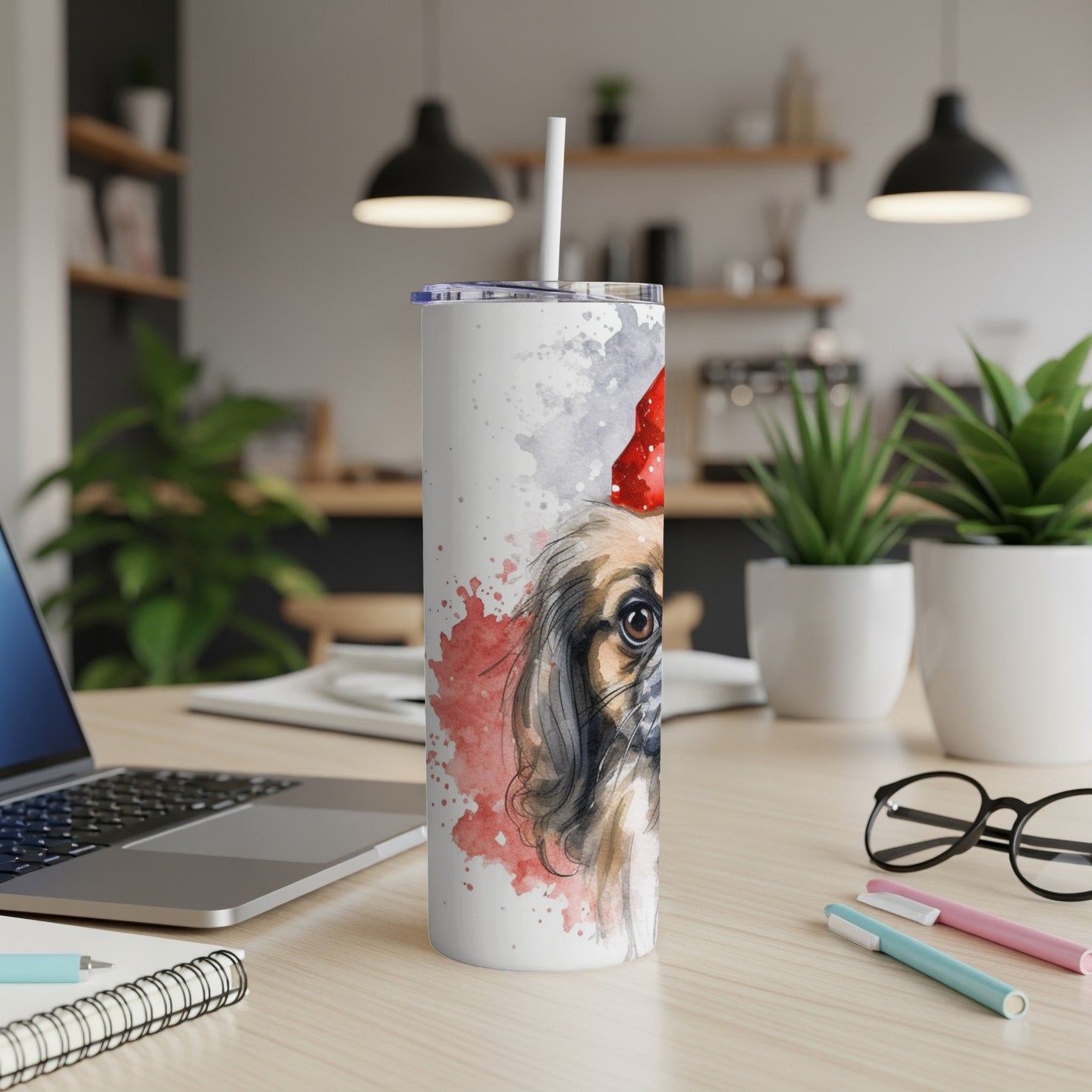Watercolor painting of a Pekingese dog wearing a Santa hat on a tall tumbler.