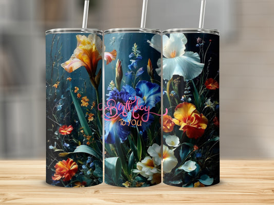 Floral tumbler with "Happy Birthday to you" text on a wooden surface.