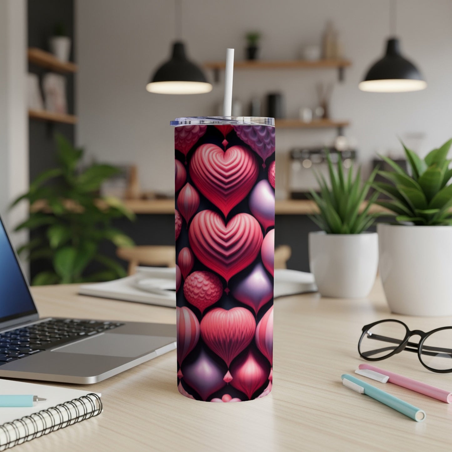 Tumbler with a repeating pattern of pink and red heart balloons.