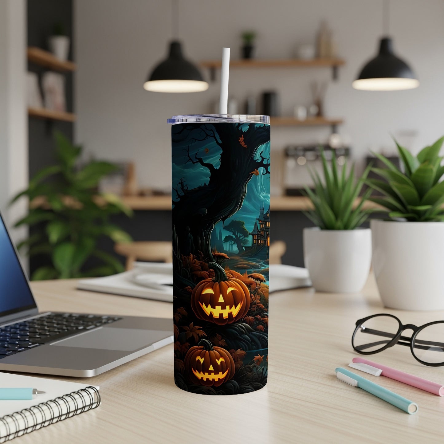 Tumbler with Halloween scene featuring carved pumpkins, a haunted house, and a spooky tree.