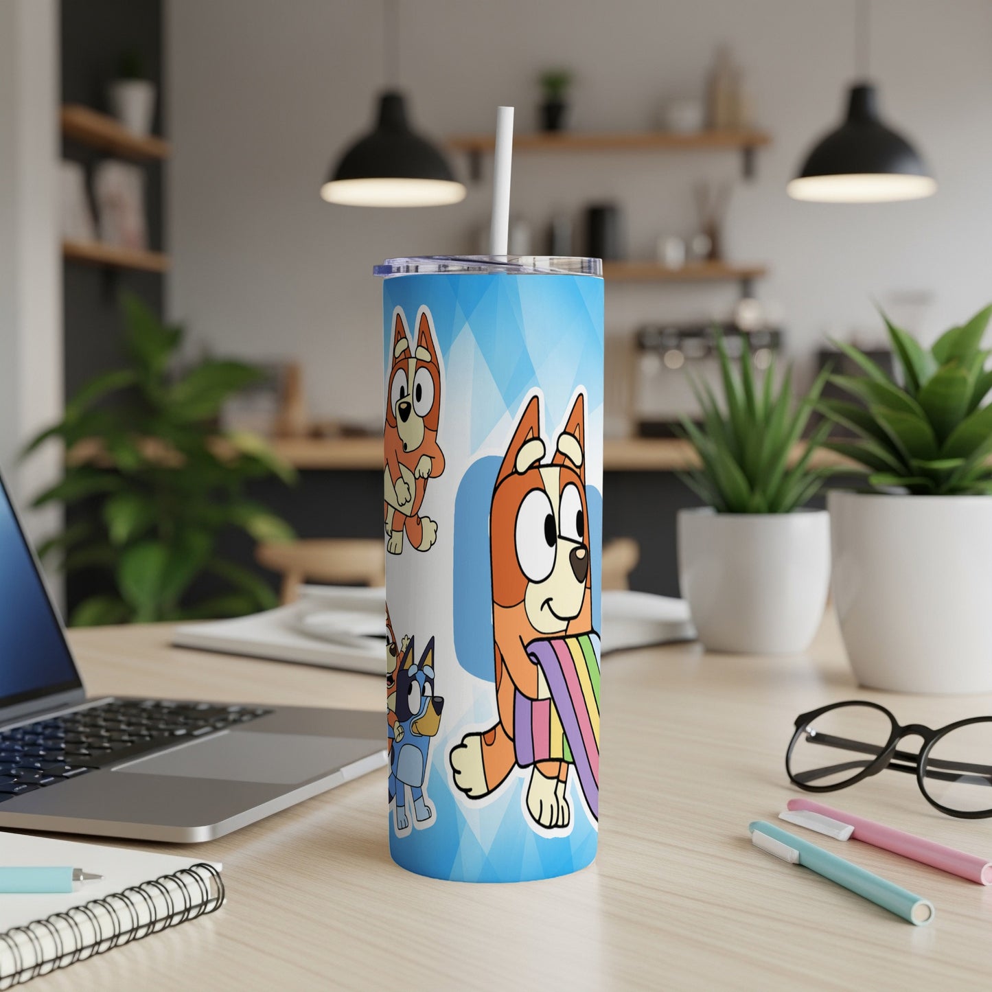 Bluey and Bingo characters on a tumbler with a rainbow.